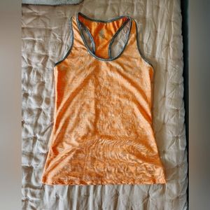 Orange Performance Tank with little rabbit details and gray outline.